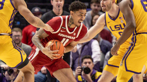 Razorbacks Jalen Lewis surrounded by Tigers on Saturday